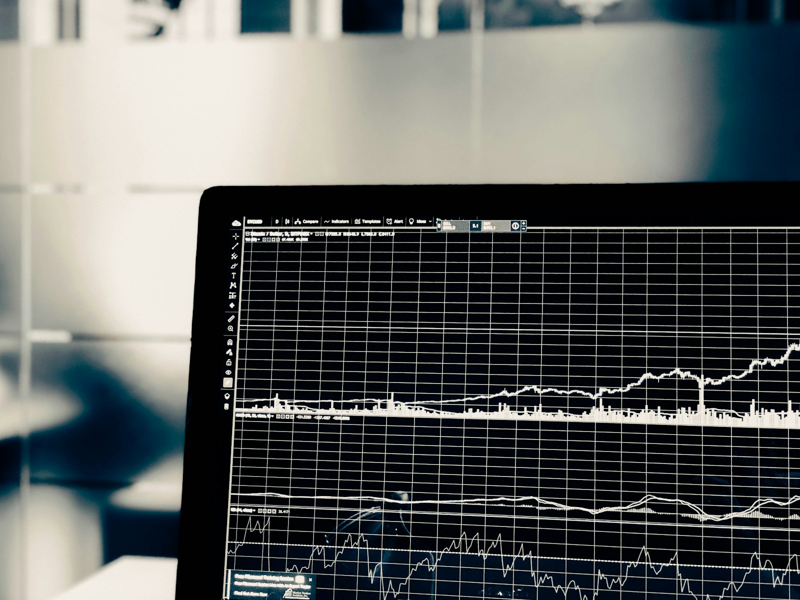 Professional trading terminal screen displaying a dense grid of multiple financial charts and data panels